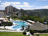 Ecuador Quito 05-02 Hotel Quito View From Our Room From our room window at the Hotel Quito we had a great view of the other buildings on top of the hill and the hotel�s swimming pool and gardens.